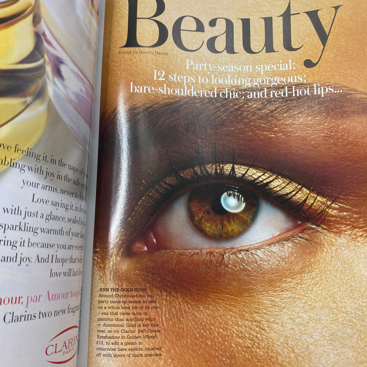 Close-up of a beauty editorial in Harpers & Queen UK Magazine December 2005, featuring an artistic eye makeup look with golden accents.