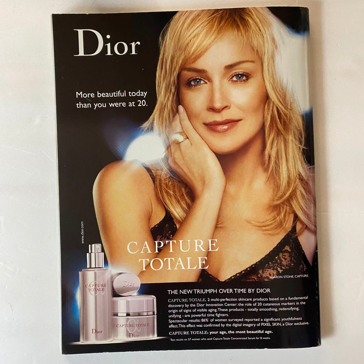 Dior advertisement from Harper's Bazaar Australia June 2006 featuring Sharon Stone promoting Capture Totale skincare line, emphasizing beauty and luxury.