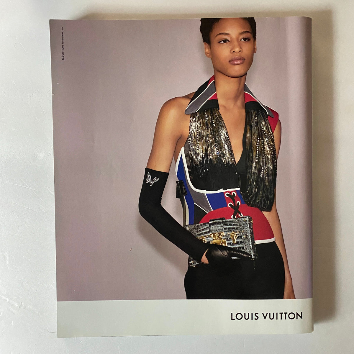 Louis Vuitton advertisement from Harper's Bazaar September 2018, featuring a model in a stylish outfit featuring elegant details.