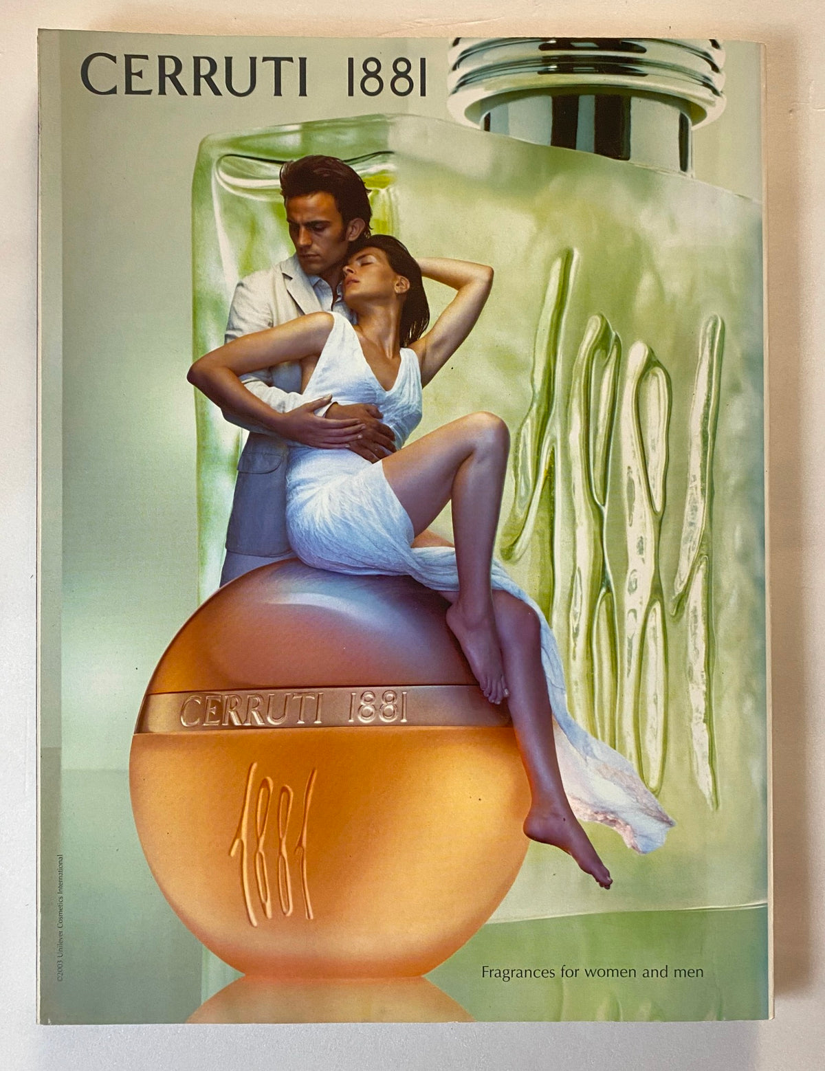 Cerruti 1881 perfume advertisement featuring a stylish couple, showcasing a blend of elegance and luxury, alongside the iconic Elle UK Magazine April 2004 Sophie Dahl cover.