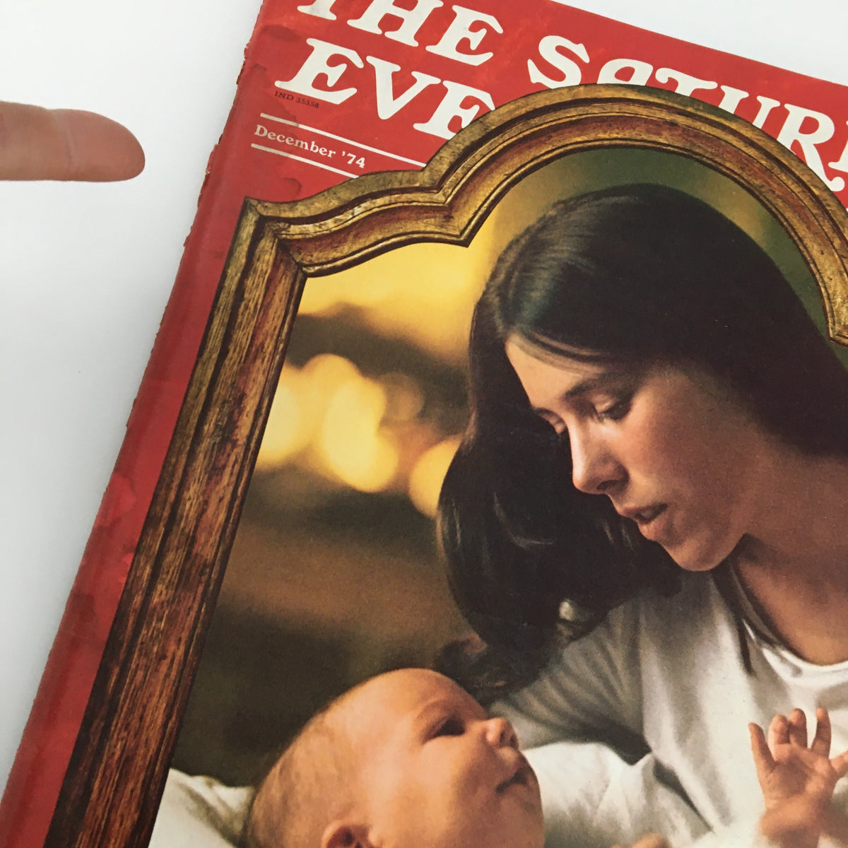 Cover of The Saturday Evening Post December 1974 featuring a touching Mother & Child image, highlighting the warmth of family during the festive season.