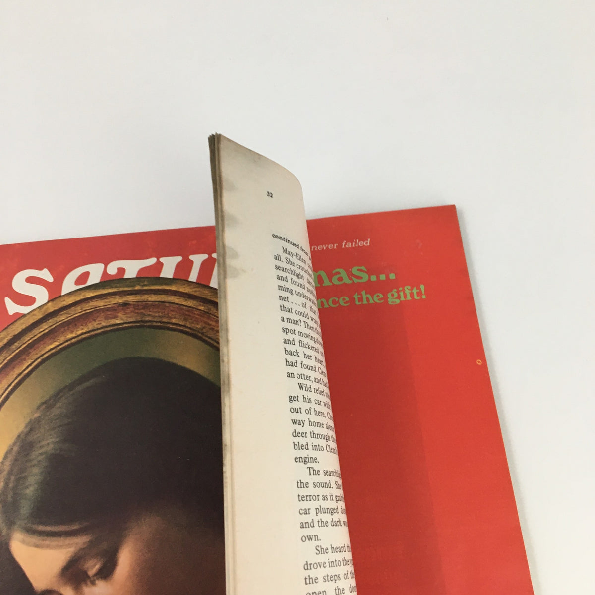 Side view of The Saturday Evening Post December 1974 with pages slightly open showing the vintage magazine style and iconic cover image.