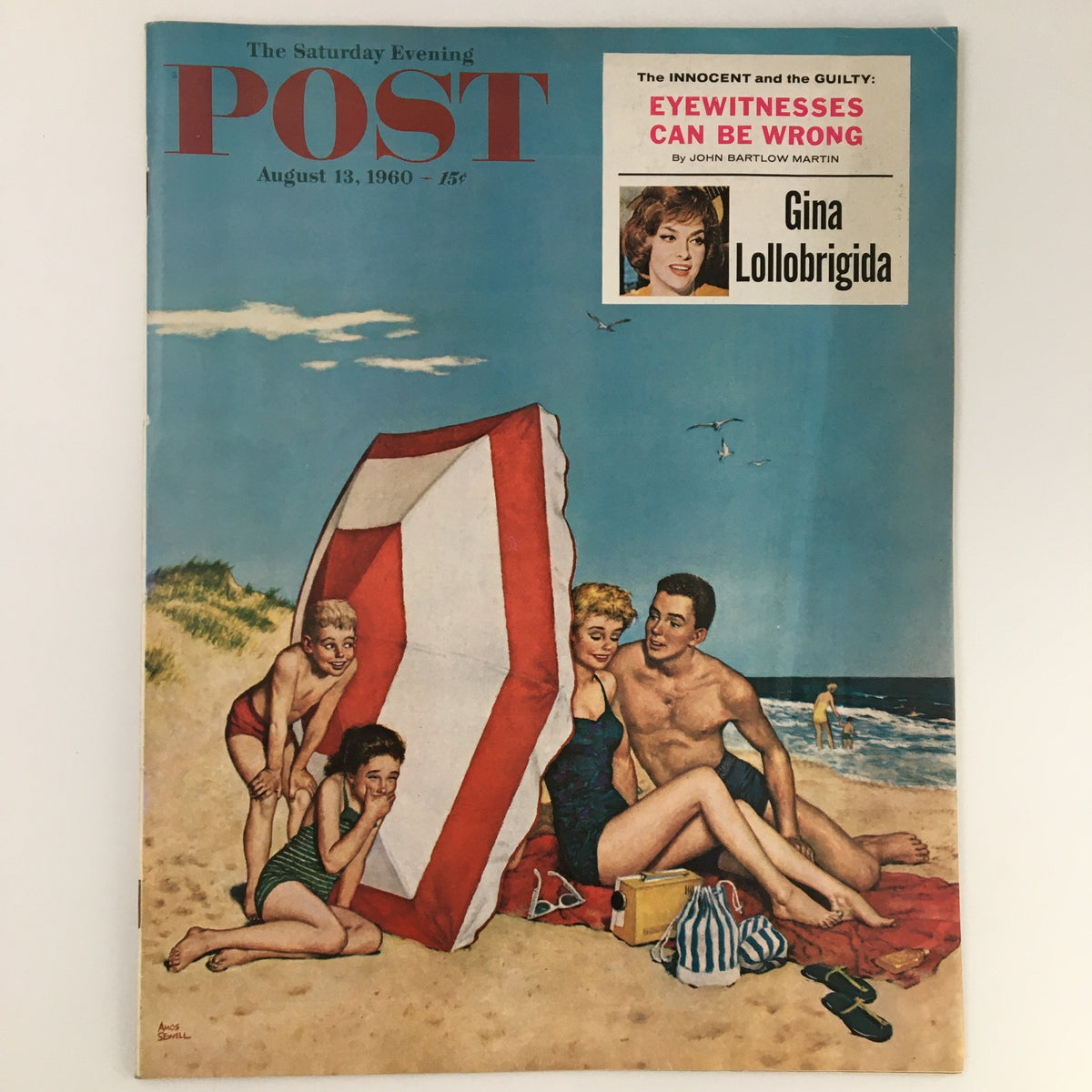 The Saturday Evening Post August 13 1960 cover featuring a vibrant beach scene by artist Amos Sewell. The illustration showcases a sandy beach with two women and two men enjoying a relaxing day, highlighting 1960s Americana.