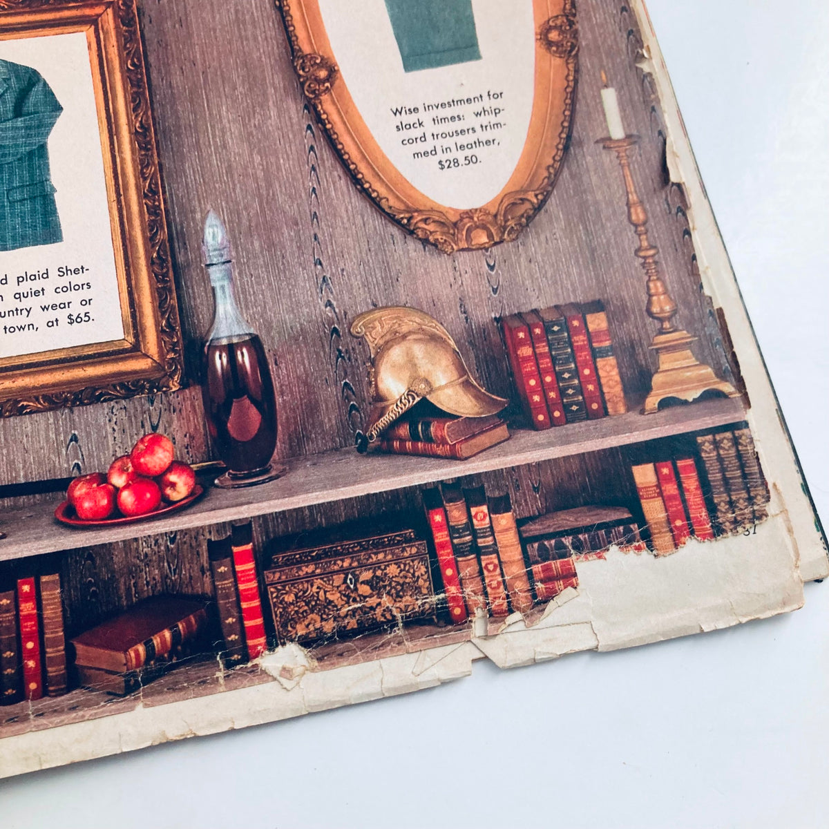 Close-up view of vintage Playboy Magazine February 1957 featuring a bookshelf with decorative items, illustrating the magazine's aesthetic and historical value.