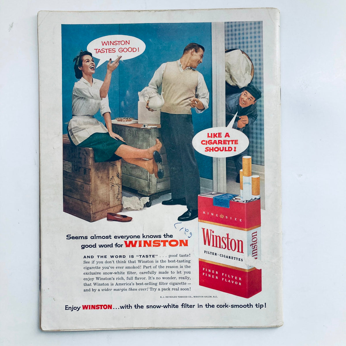Vintage advertisement featuring Winston cigarettes, promoting their taste, with an engaging scene and dialogue in a 1950s style, from the May 1957 Playboy Magazine featuring Dawn Richard.