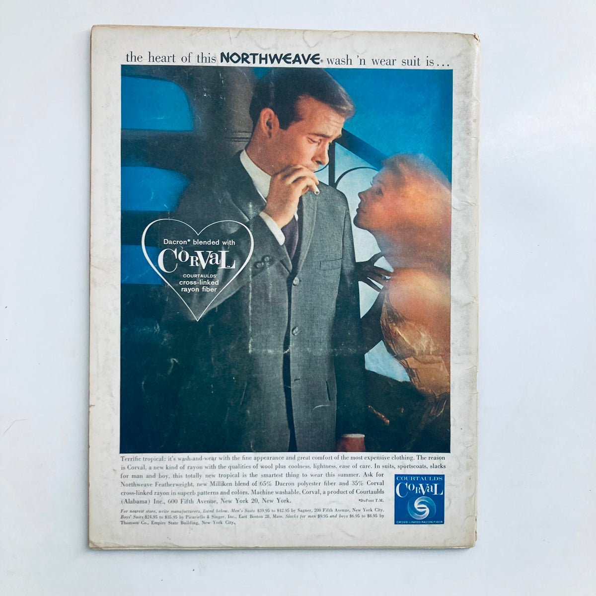 Back cover of VTG Playboy Magazine March 1960 displaying an advertisement for Corval clothing, showcasing a stylish couple in a vintage setting.
