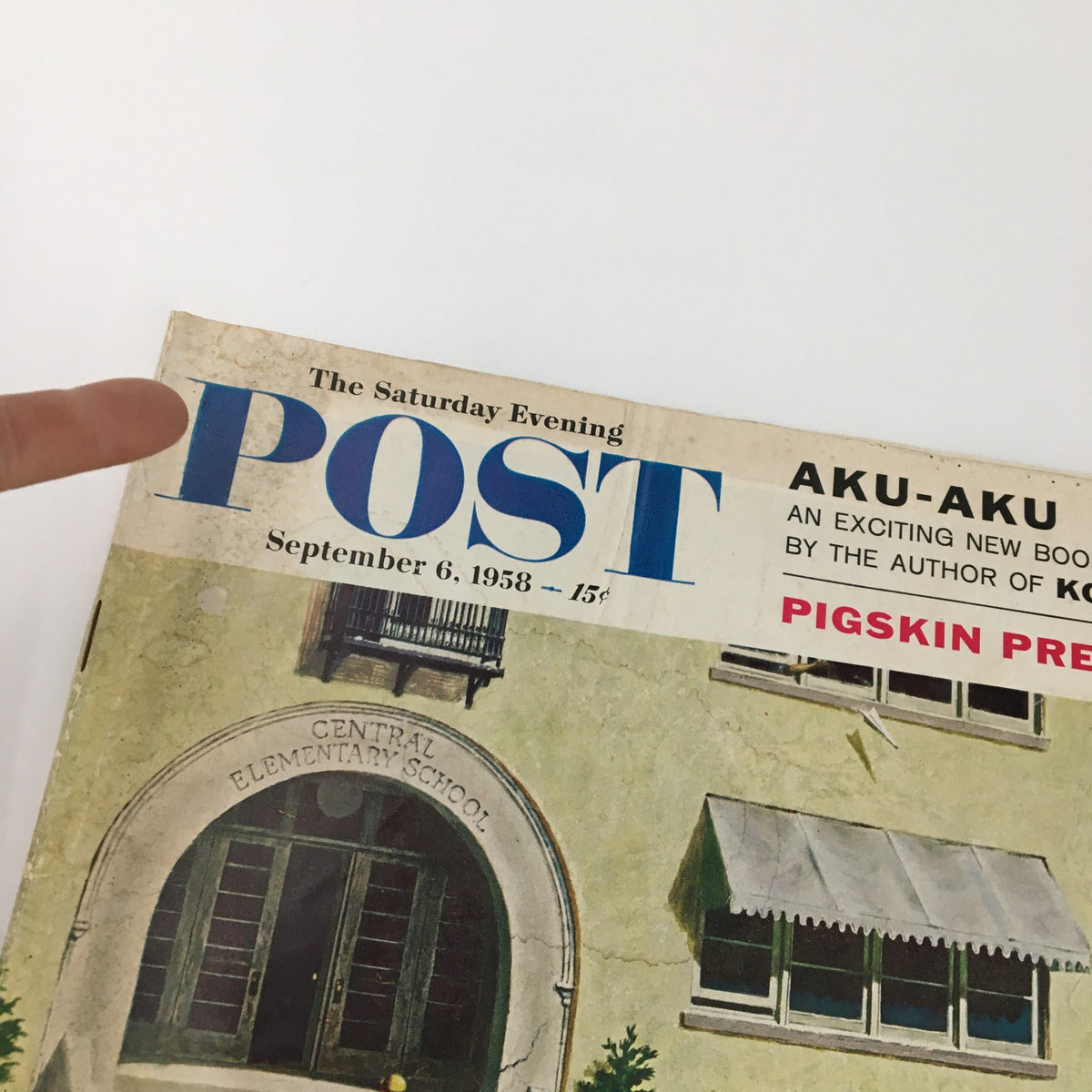 Close-up of The Saturday Evening Post, September 6, 1958, cover title highlighting 'Pigskin Preview.' The image focuses on the magazine's logo and the date.