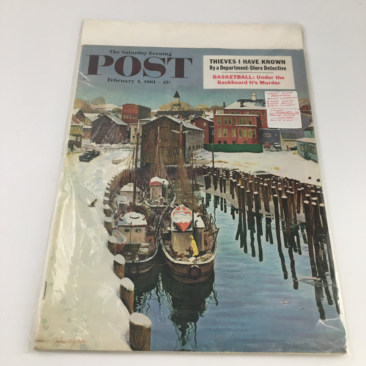 Another angle of the cover of The Saturday Evening Post from February 4, 1961, showcasing snow-covered boats and the iconic title along with article highlights.