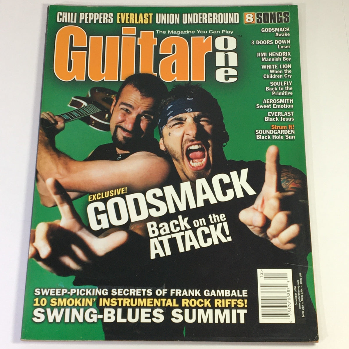 Cover of Guitar One Magazine December 2000 featuring Godsmack with the headline 'Exclusive! Godsmack Back on the AT TACK!' highlighting rock legends Godsmack, 3 Doors Down, and Jimi Hendrix.