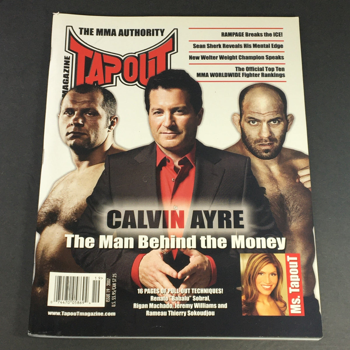 Cover of Tapout MMA Magazine #19 from 2007 featuring Calvin Ayre, Renato Sobra, and Rigan Machado. The magazine showcases interviews and insights from MMA icons, highlighting their contributions to mixed martial arts.