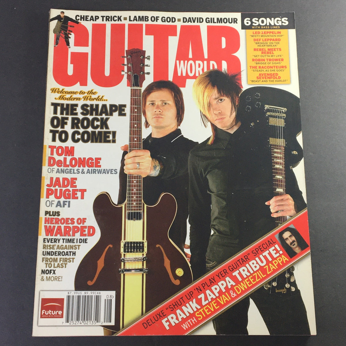 Guitar World Magazine August 2006 cover featuring Tom Delonge and Jade Puget, showcasing their iconic presence in rock music, along with a tribute to Frank Zappa.