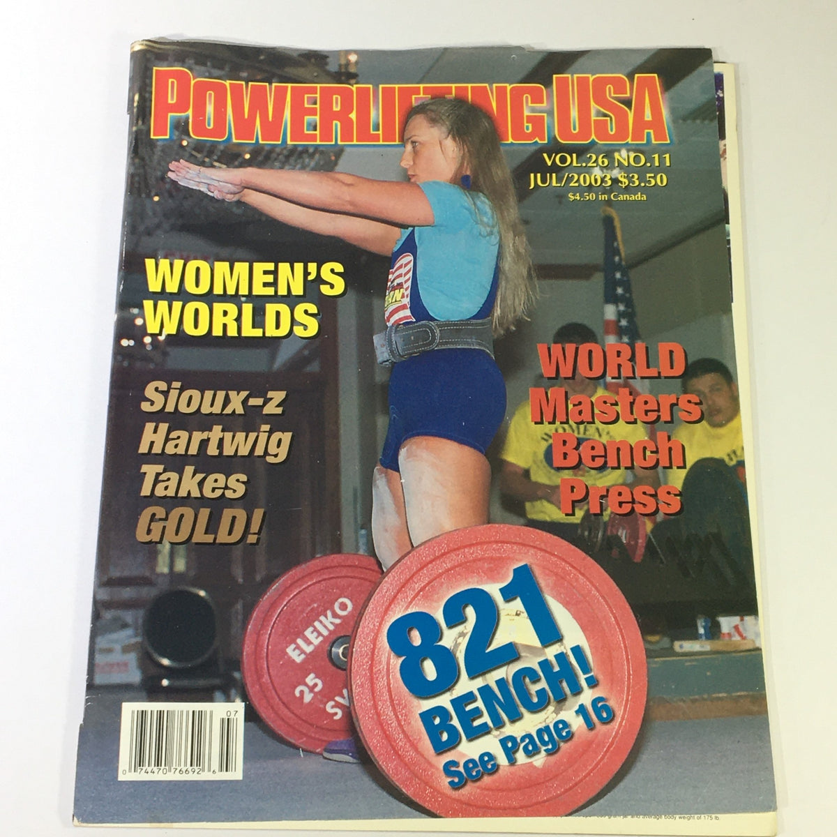 Cover of Powerlifting USA July 2003 Vol 26 #11 featuring IPF World Champion Sioux-z Hartwig, highlighting Women's Worlds and the 821 Bench Press record.
