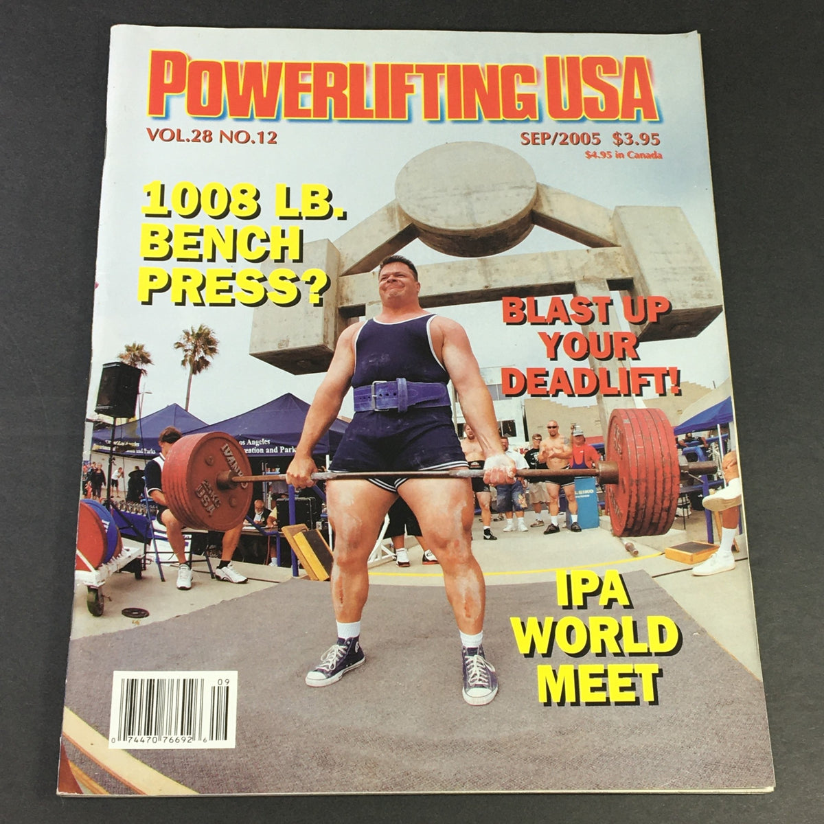 Cover of Powerlifting USA September 2005 Vol 28 #12 featuring a strongman lifting weights at Muscle Beach Venice. The magazine discusses powerlifting techniques and events.