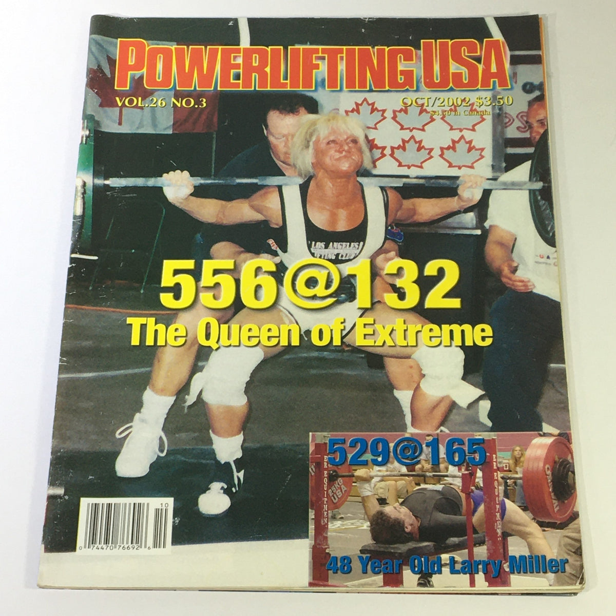 Powerlifting USA October 2002 Vol 26 #3 magazine cover featuring Nance Avigliano performing a squat with the caption '556@132 The Queen of Extreme' and a photo of Larry Miller with the caption '529@165 48 Year Old Larry Miller'.