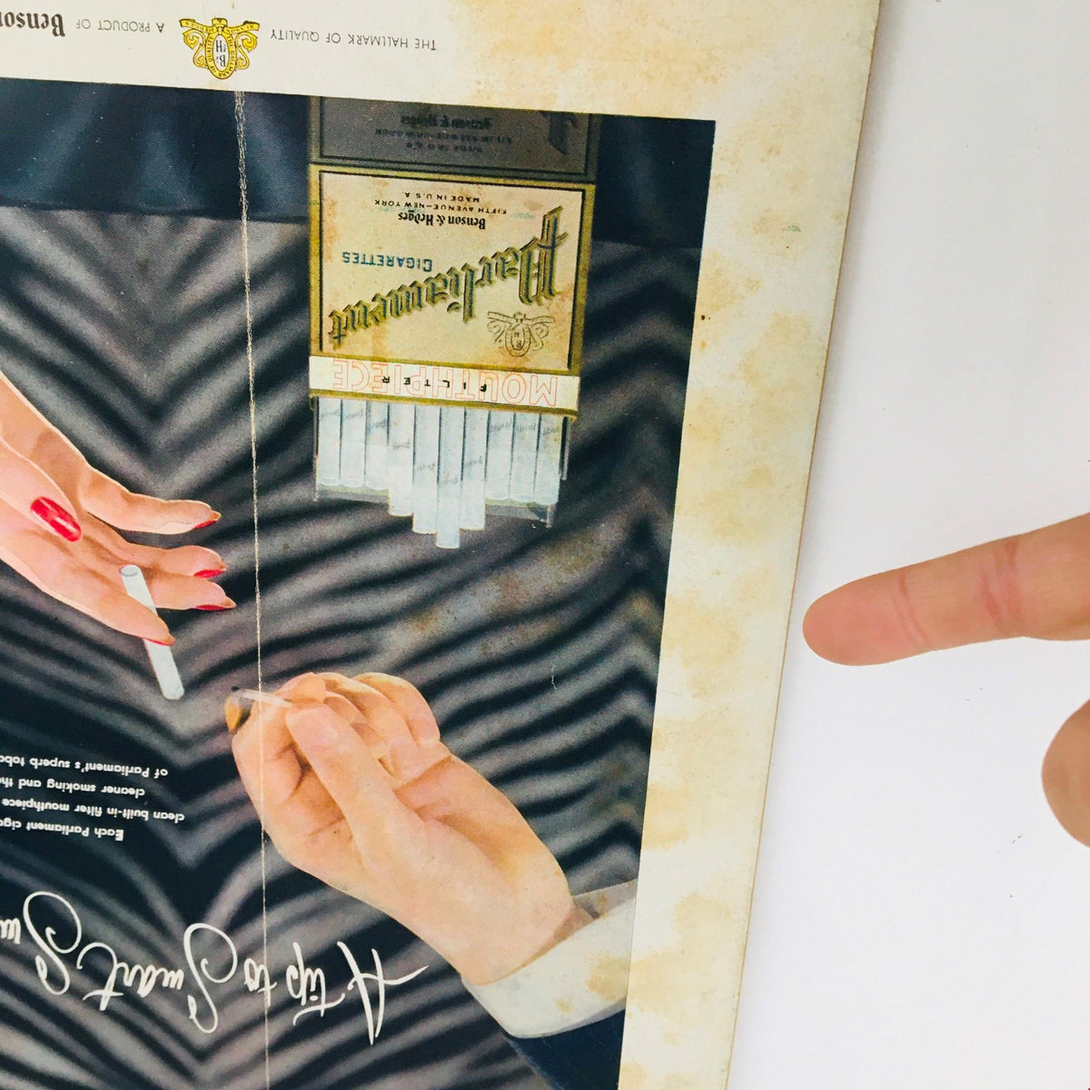 Image of the interior page from The New Yorker Magazine May 31 1952 featuring an advertisement with elegant hands holding cigarettes, promoting the Parliament brand.