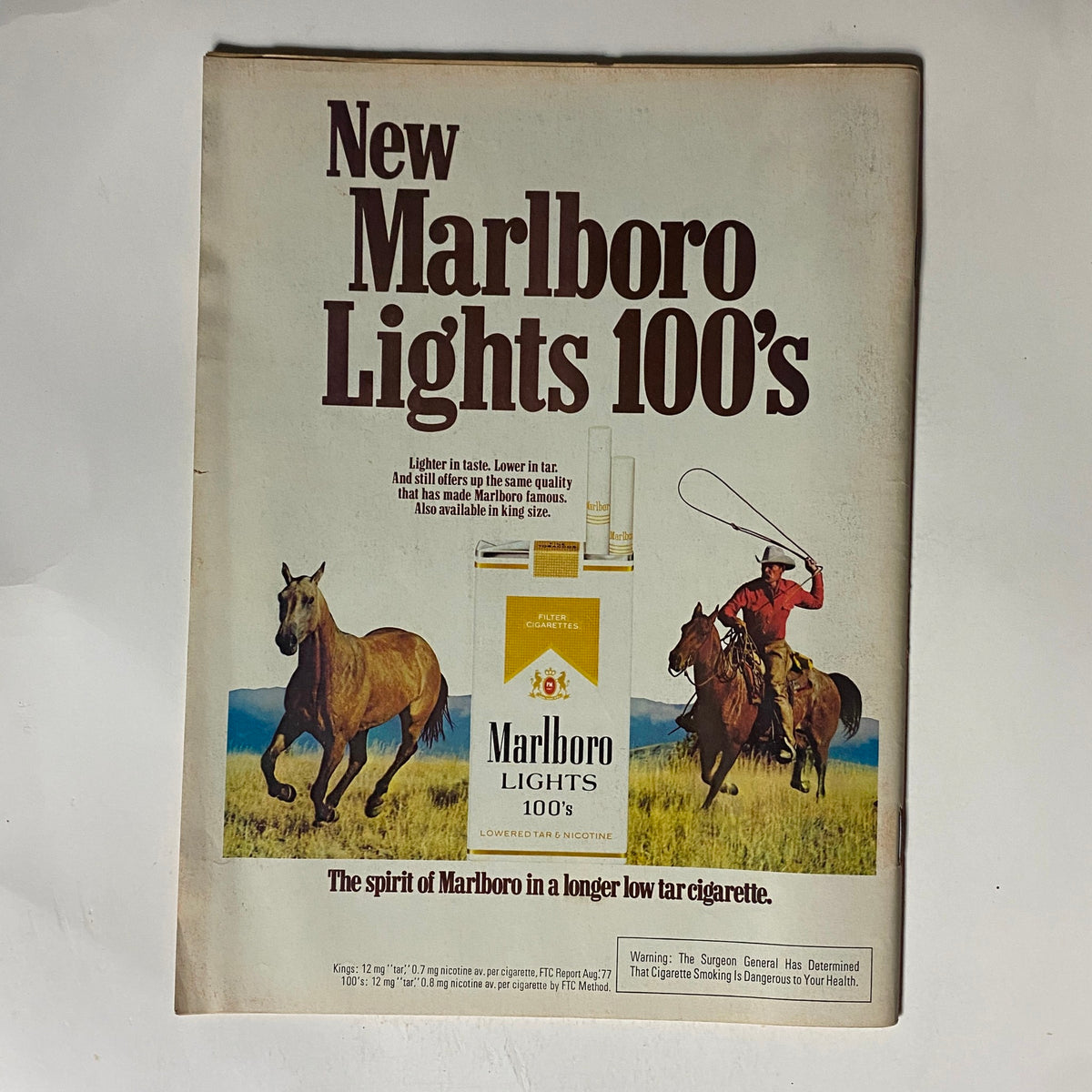 Advertisement page from VTG Time Magazine February 27, 1978 promoting Marlboro Lights 100's cigarettes, featuring an image of a cowboy on horseback.