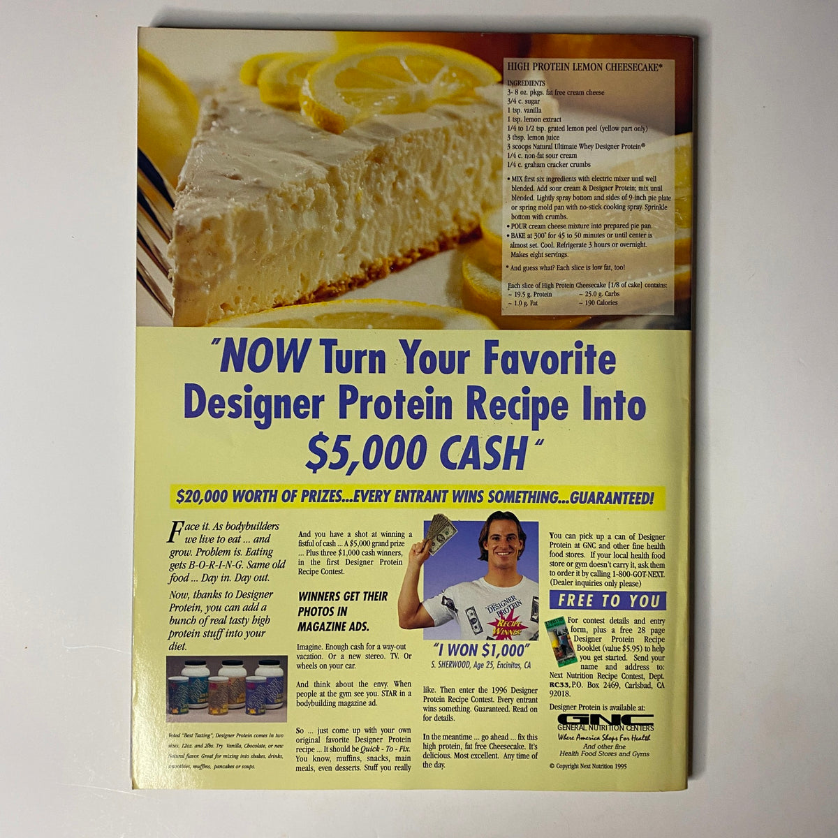 Back cover of Muscular Development Magazine February 1996 featuring a promotional contest for cash prizes related to a protein dessert recipe, encouraging readers to engage. Includes a photo of a smiling contestant holding a check.