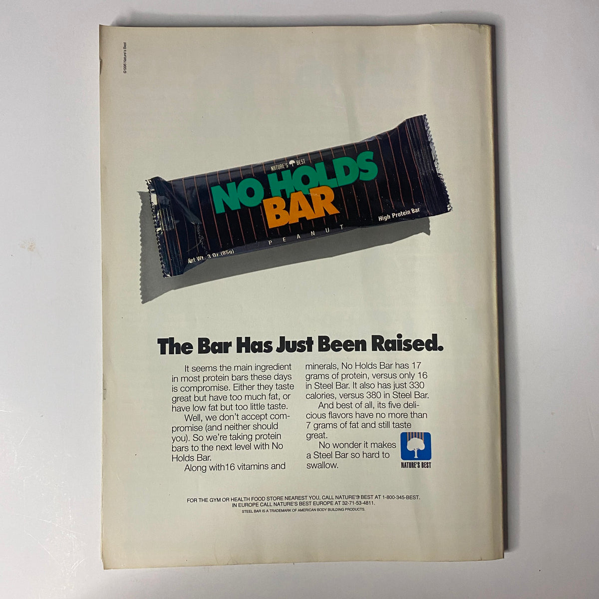 Back cover ad from Muscular Development Magazine March 1996 promoting No Holds Bar protein bars, emphasizing health and nutrition for bodybuilders.
