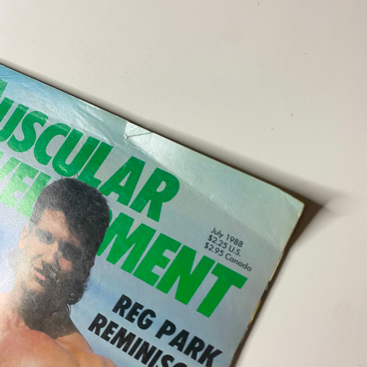 Close-up of the cover of Muscular Development Magazine July 1988, showcasing Francois Musé and Reg Park, highlighting the issue's publication date and price.
