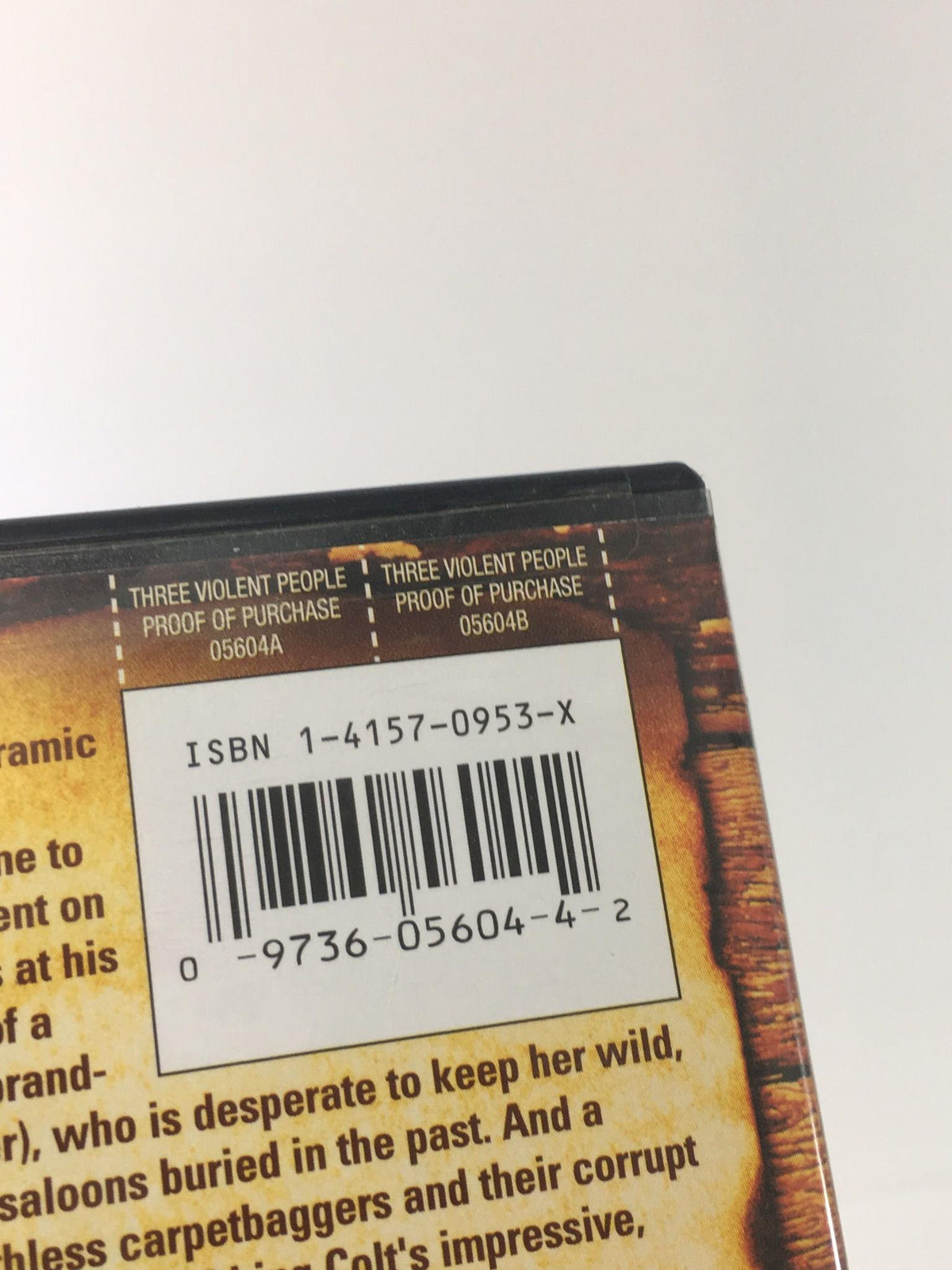 Top view of the Three Violent People 2005 DVD case including the ISBN barcode and purchase proof label.