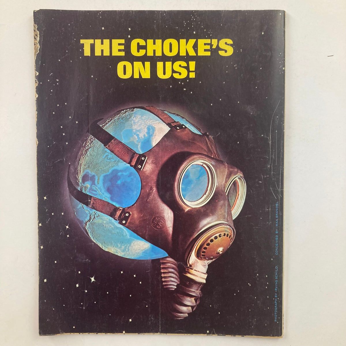 Back cover of Mad Super Special Magazine 1976 No. 21 with an artistic depiction of a gas mask planet against a space background, emphasizing the magazine's creative and satirical style.