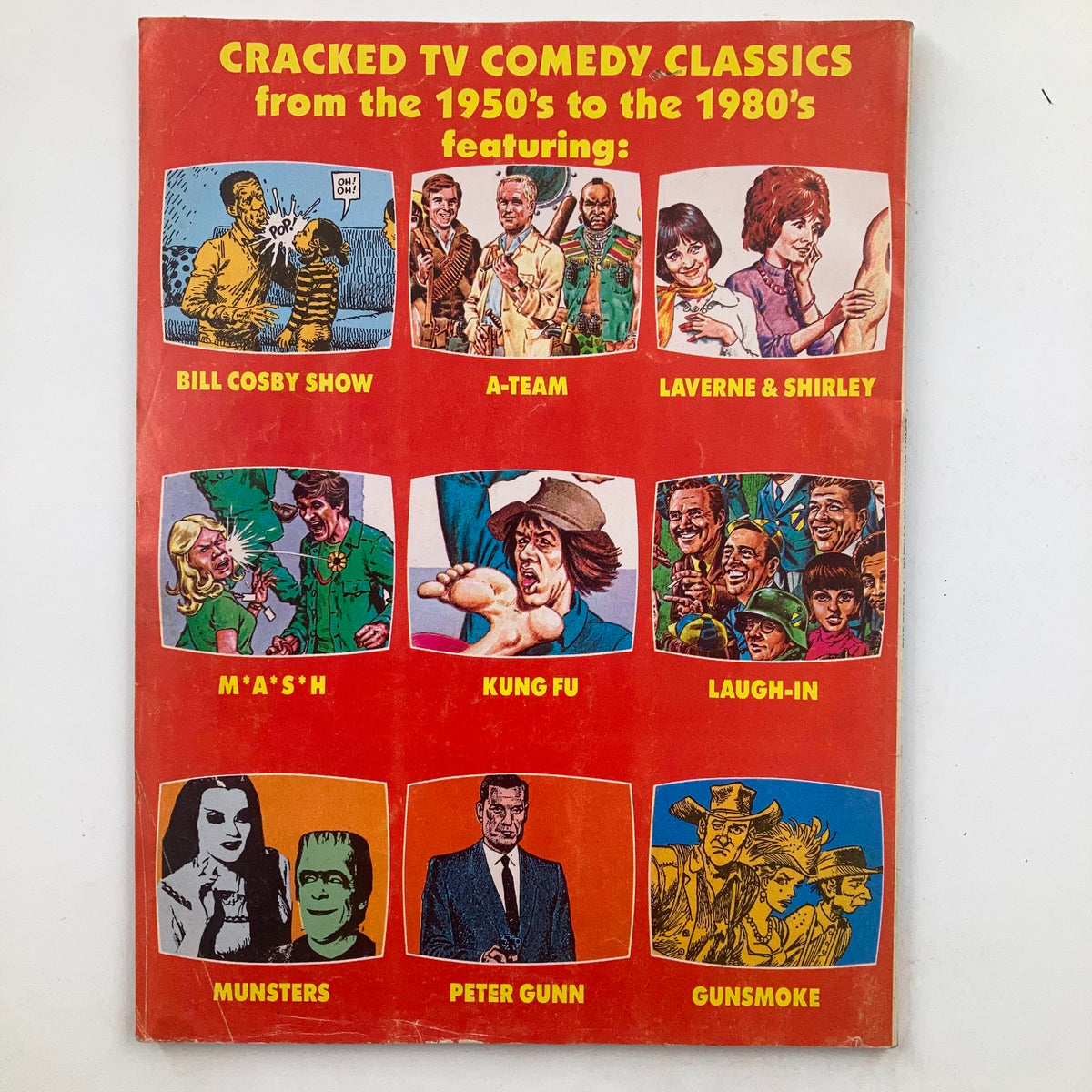 Cover of Giant Cracked Magazine July 1986 No. 44 featuring iconic shows from the 1950s to the 1980s, including Bill Cosby Show, A-Team, Laverne & Shirley, M*A*S*H, Kung Fu, Laugh-In, Munsters, Peter Gunn, and Gunsmoke.