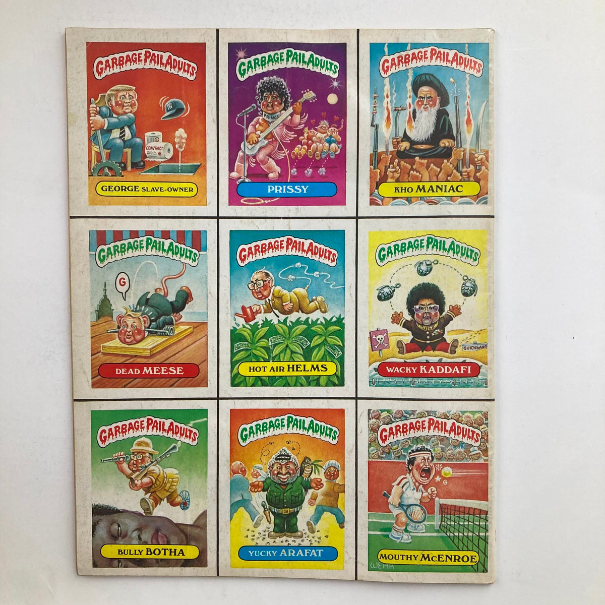 Mad Magazine September 1986 No. 265 featuring Garbage Pail Adults trading cards depicting humorous and satirical caricatures of notable figures like George Slave-Owner, Prissy, Kho Maniac, Dead Meese, Hot Air Helms, Wacky Kaddafi, Bully Botha, Yucky Arafat, and Mouthy McEnroe.