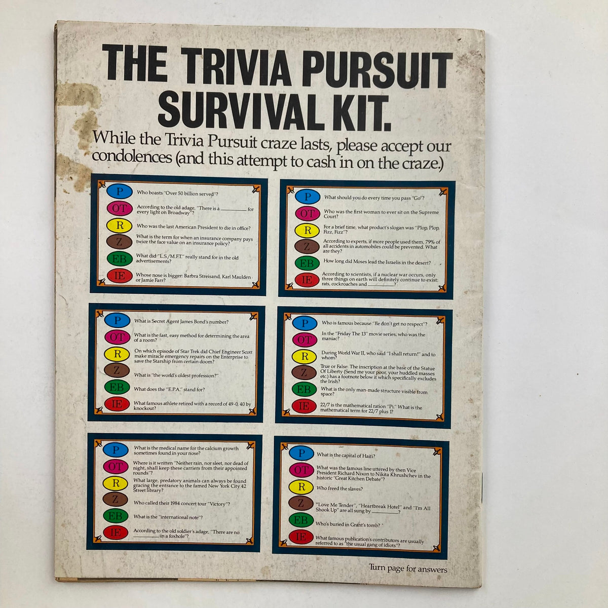 Back cover of Mad Magazine July 1985 No. 256 displaying The Trivia Pursuit Survival Kit, filled with humorous trivia questions and answers.