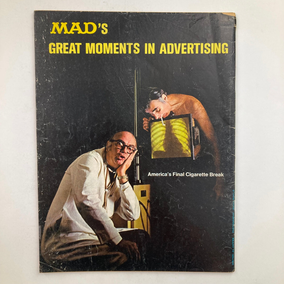 Cover of Mad Magazine's special issue titled 'Mad's Great Moments in Advertising', depicting a humorous take on advertising trends with quirky illustrations.