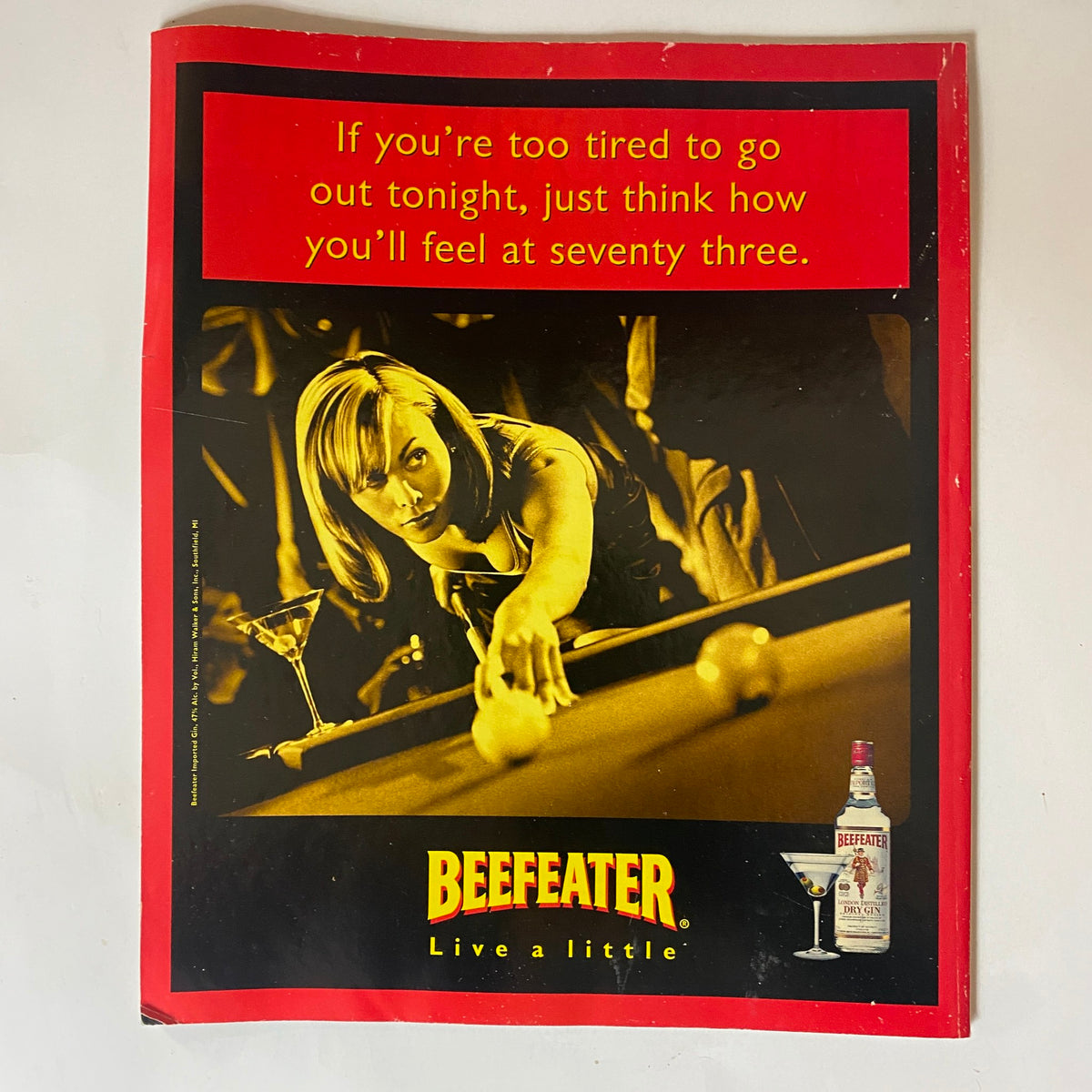 Back advertisement page of George Magazine January 1997 with a promotional image for Beefeater gin, featuring a woman playing pool.
