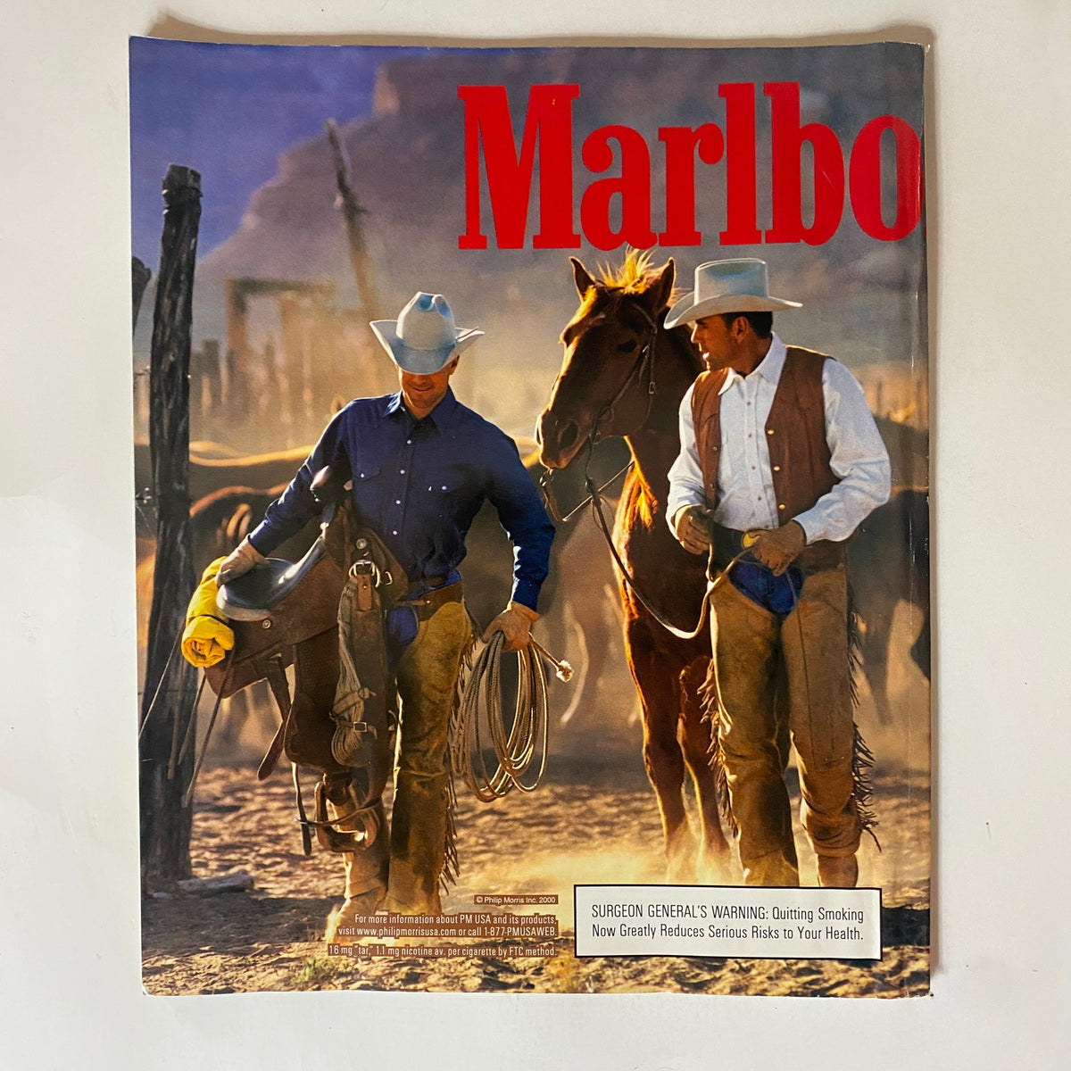 Cover of Marlboro magazine showcasing two cowboys with horses, emphasizing the outdoor lifestyle.