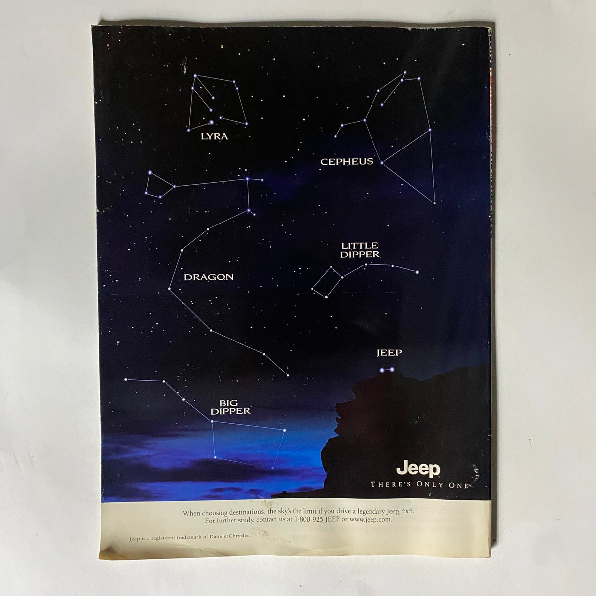 Back cover of George Magazine February 1999 featuring a Jeep advertisement with constellations, adding a unique element to the vintage magazine.