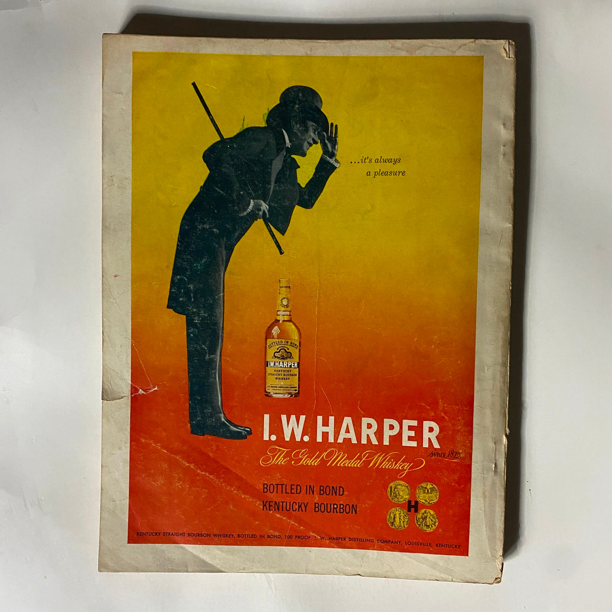 Advertisement page for I.W. Harper whiskey in Harper's Magazine October 1950, showcasing vintage branding and imagery.