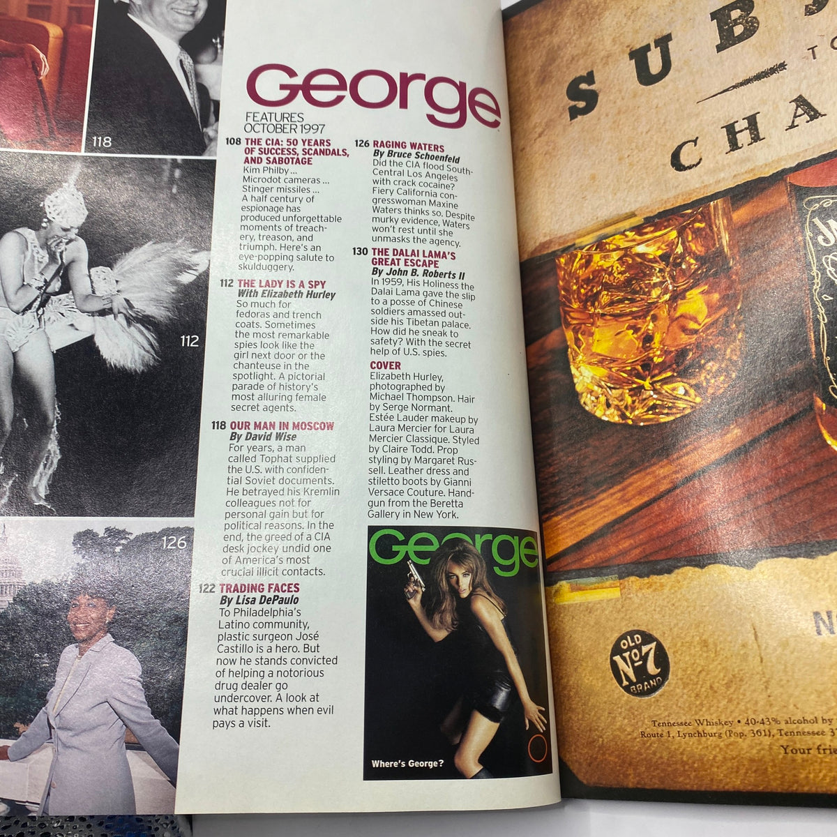 Interior page of George Magazine October 1997 featuring an article titled 'The Lady is a Spy' with Elizabeth Hurley as the cover model. The page highlights content related to celebrity culture and politics, showcasing the unique blend of themes in the magazine.