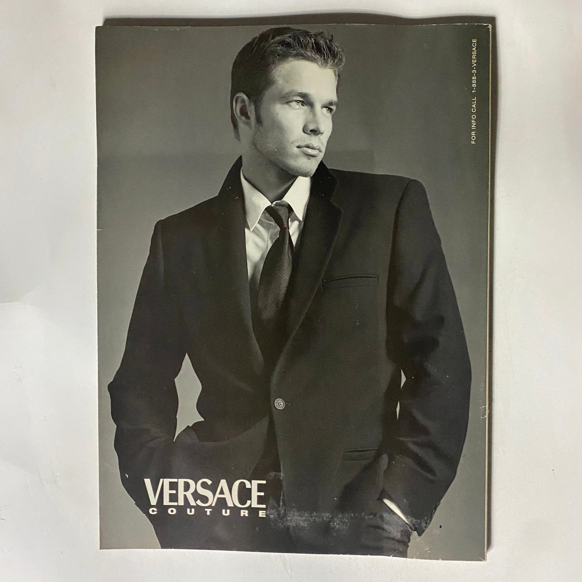 Back cover of George Magazine March 1998 showcasing a Versace advertisement, highlighting fashion amidst 1990s pop culture.