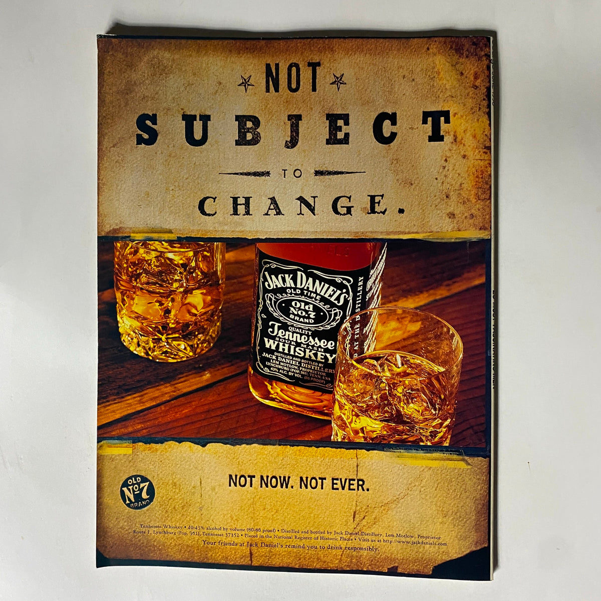 Jack Daniel's advertisement featured in George Magazine June 1998, cleverly designed with a whiskey bottle and glasses, appealing to collectors of vintage brands.