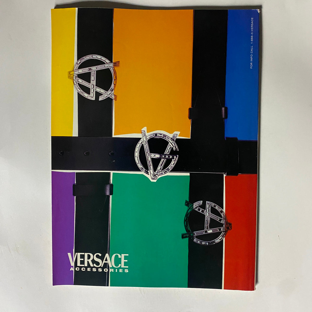 Versace Accessories promotional magazine cover featuring bold colors and unique designs related to fashion, illustrating luxury style, from George Magazine August 1998 Charlize Theron Cover American Dream.