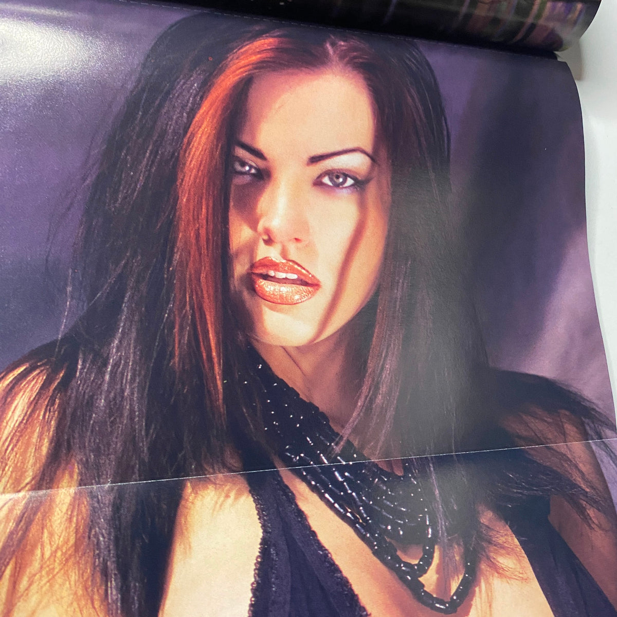Close-up photo from Muscular Development Magazine May 2003 featuring Dana Hamm, highlighting her striking look and engaging style as part of the magazine's pictorial.