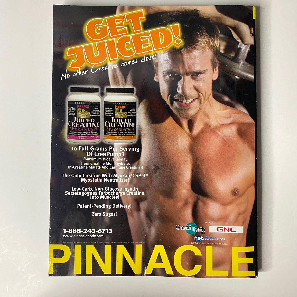 Muscular Development Magazine October 2003 featuring Lee Priest and Tabitha Taylor, showcasing a promotional advertisement for Pinnacle Creatine products with a muscular athlete promoting fitness supplements.