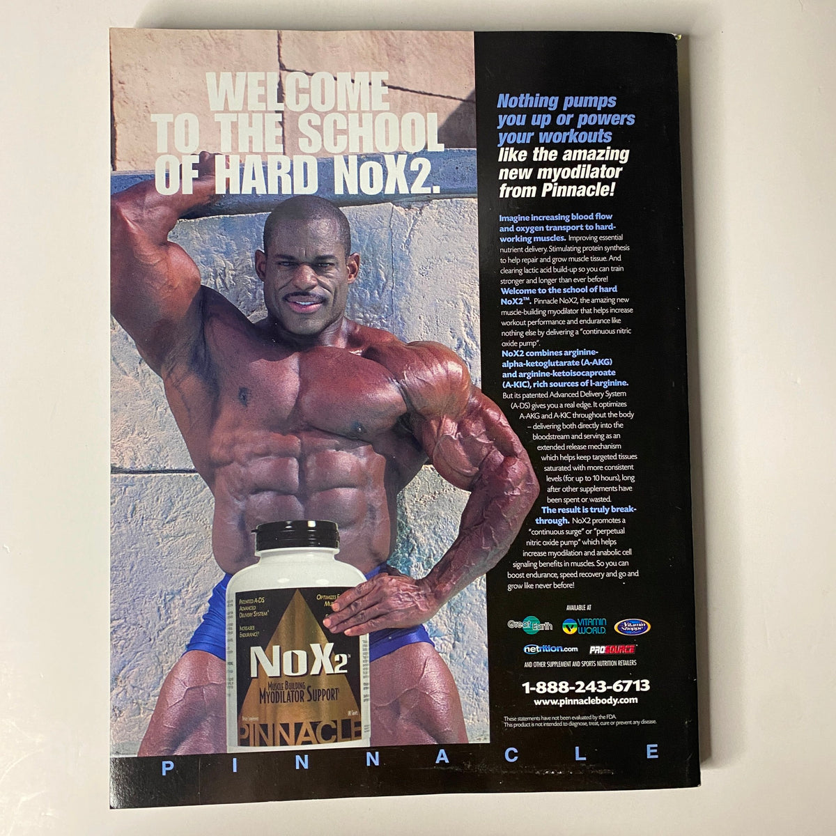Back cover of Muscular Development Magazine December 2003 featuring an advertisement for NOx2 by Pinnacle, showcasing a muscular bodybuilder posing. This issue includes a poster of Markus Rühl and highlights early 2000s bodybuilding culture.