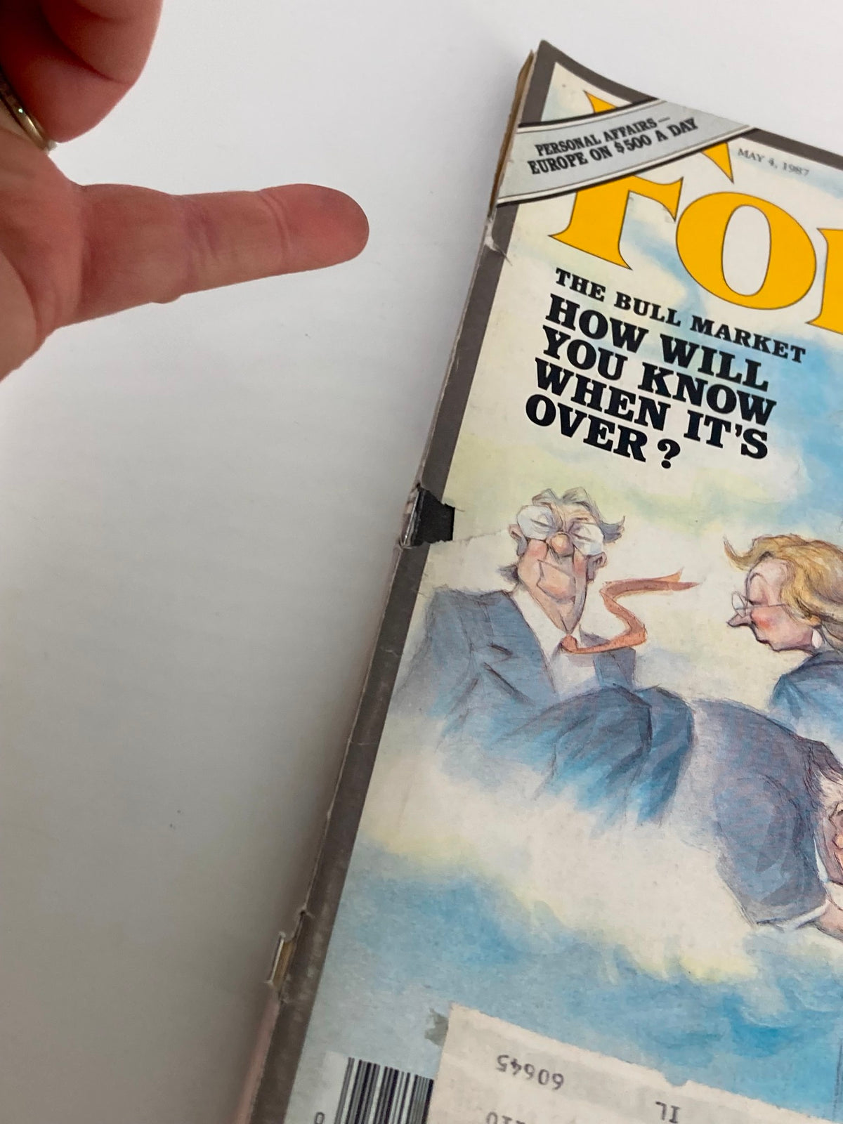 Close-up view of the cover of Forbes Magazine May 4, 1987, showing the title 'The Bull Market' and an illustration of businessmen.