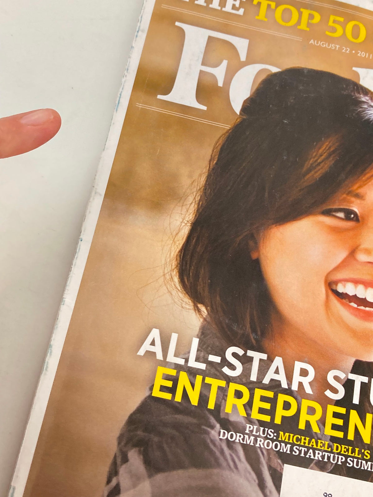 Close-up view of the cover of Forbes Magazine from August 22, 2011, displaying Ernestine Fu and the 'All-Star Student Entrepreneurs' headline.