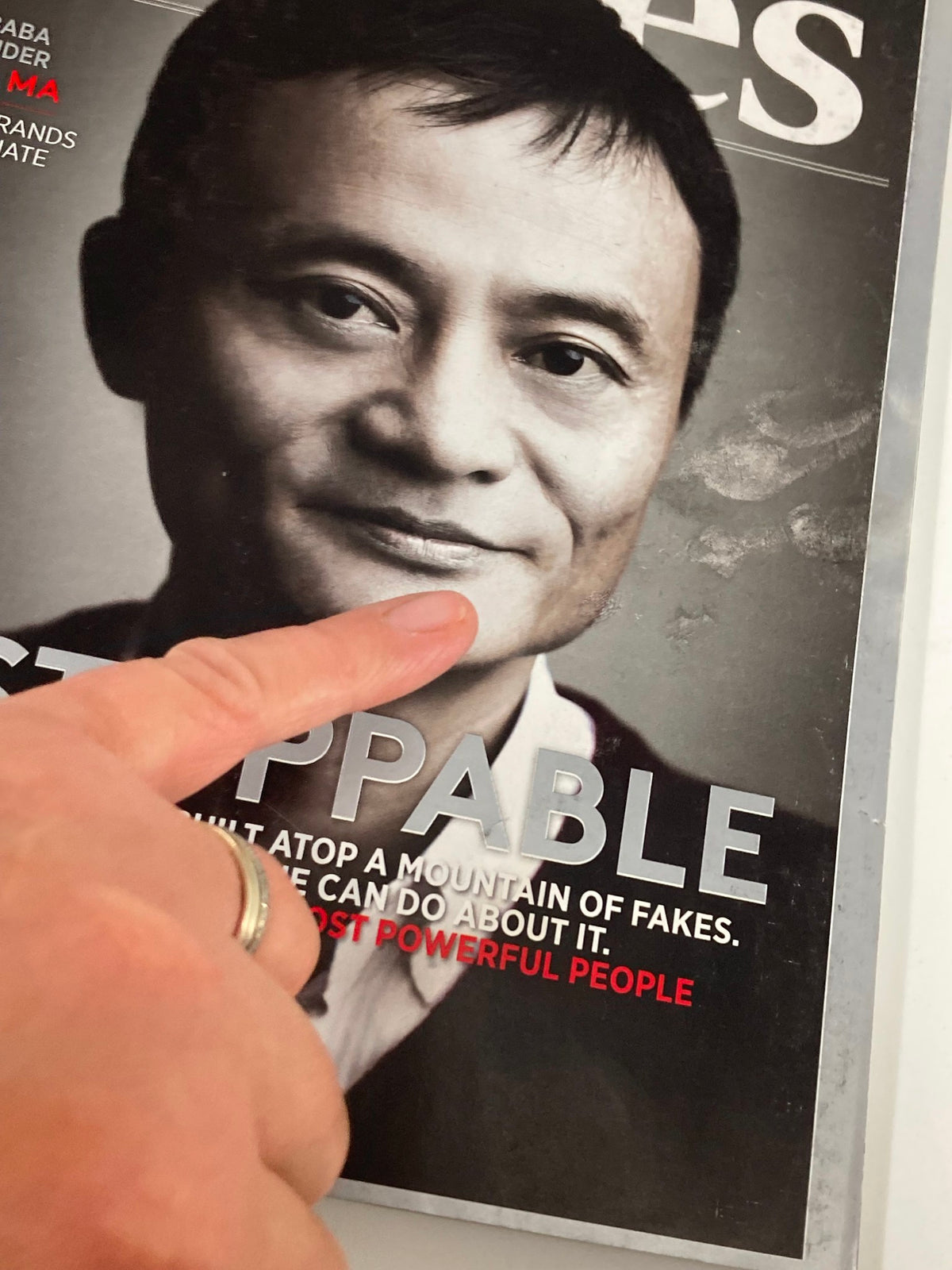 Close-up of Forbes Magazine cover from November 23, 2015, focusing on Jack Ma's image and the caption 'Unstoppable', emphasizing his role among the world's most powerful people.