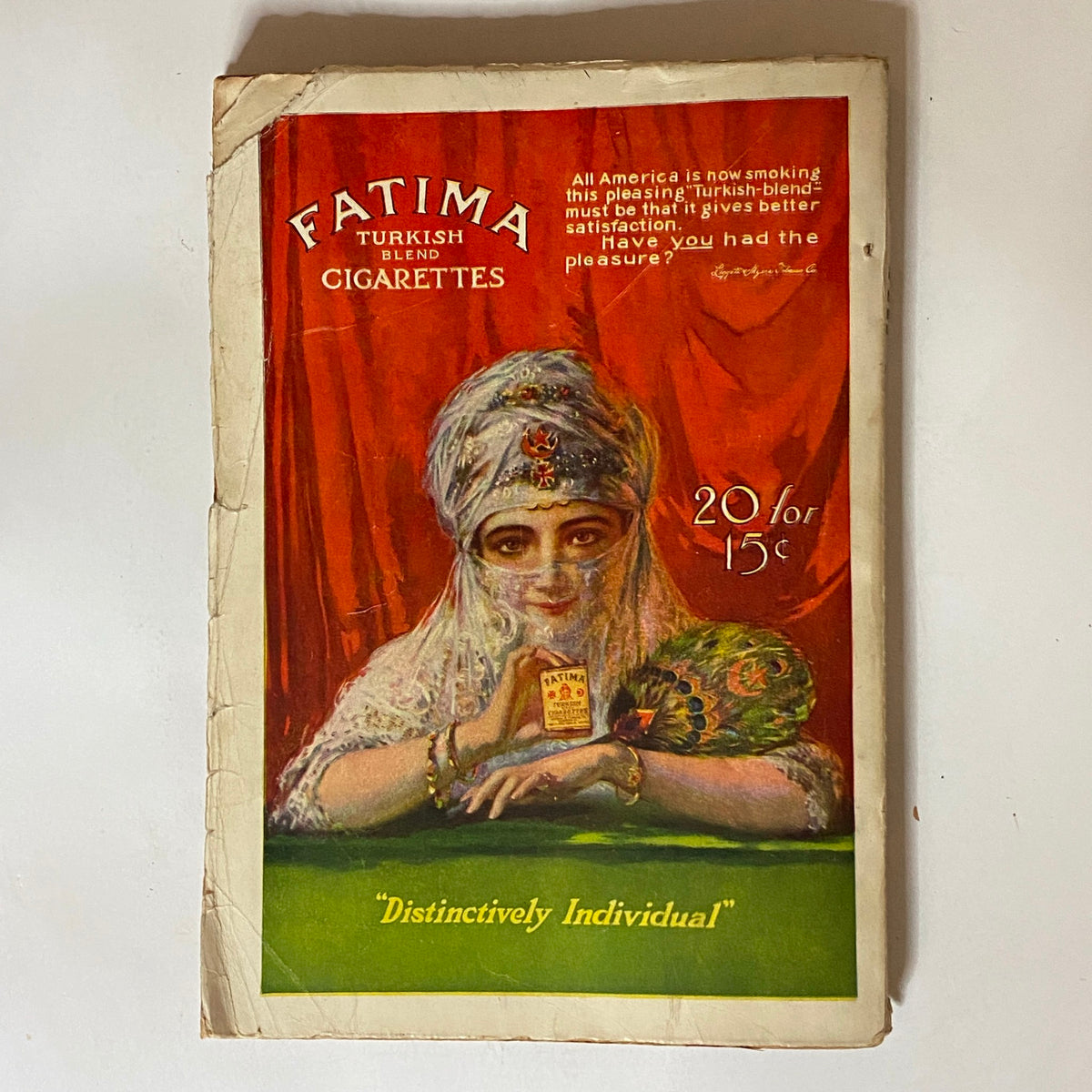 Cover of VTG The Popular Magazine February 15, 1913 featuring an advertisement for Fatima Turkish Blend Cigarettes, showcasing a woman in traditional attire and the text 'Distinctively Individual' with the offer of 20 cigarettes for 15 cents. Essential collectible depicting early 20th-century American culture.