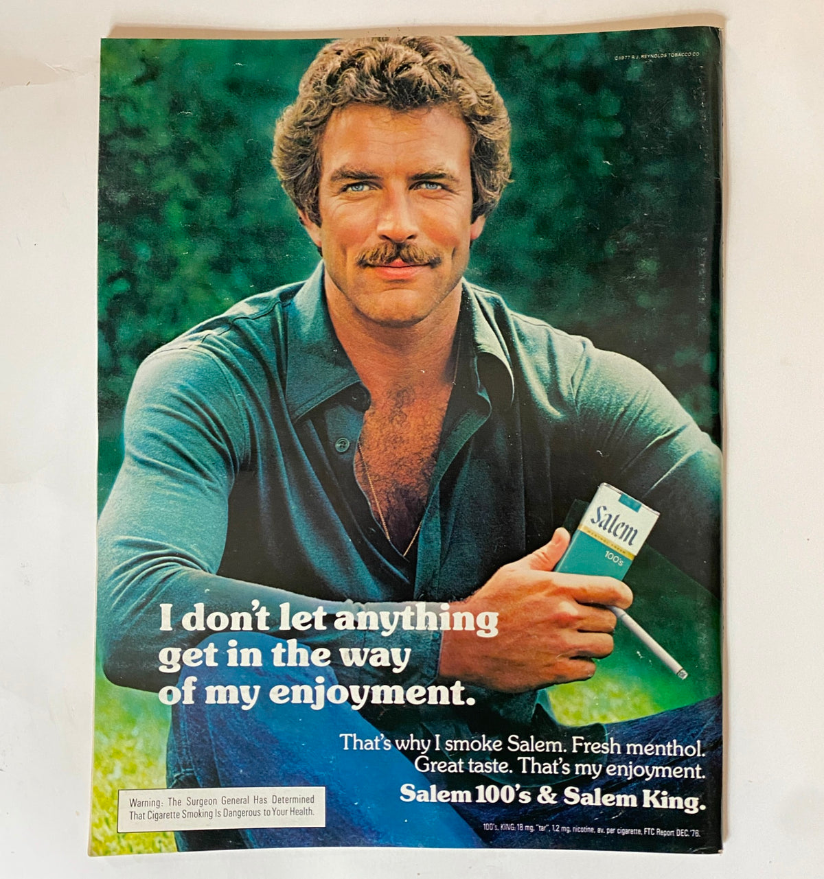 Advertisement from The Saturday Evening Post August 1977 Special 250th Anniversary, featuring a man promoting Salem cigarettes with a slogan about enjoyment.