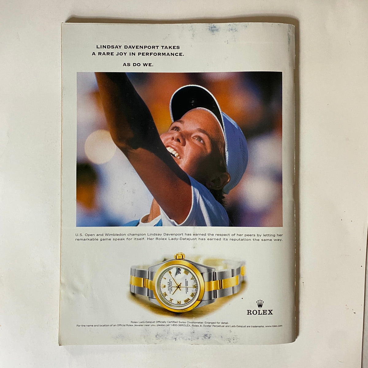 Ad page from Tennis Magazine May 2001 promoting a Rolex watch along with a photo of tennis player Lindsay Davenport, emphasizing luxury and women's tennis.
