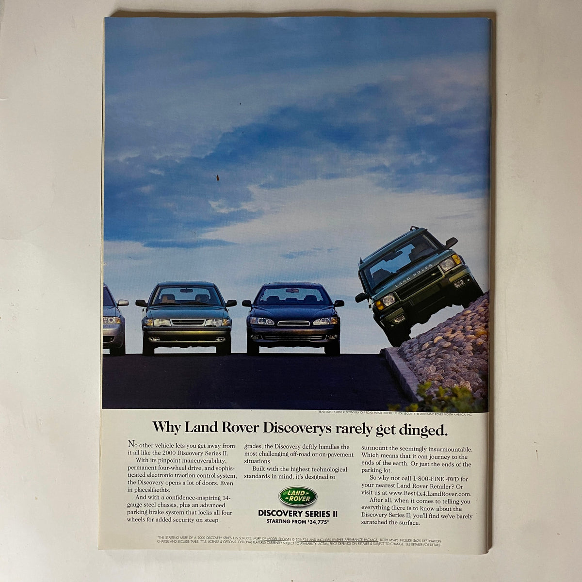 Advertisement for Land Rover emphasizing the durability of Discovery SUVs, featured in the Tennis Magazine June 2000 issue with Andre Agassi on the cover.