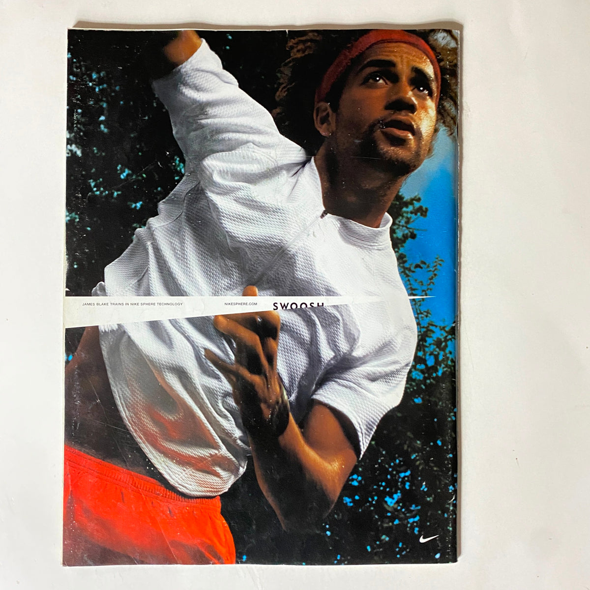 Back cover of Tennis Magazine October 2002, featuring an athletic model promoting Nike apparel, adding to the vintage magazine's appeal.