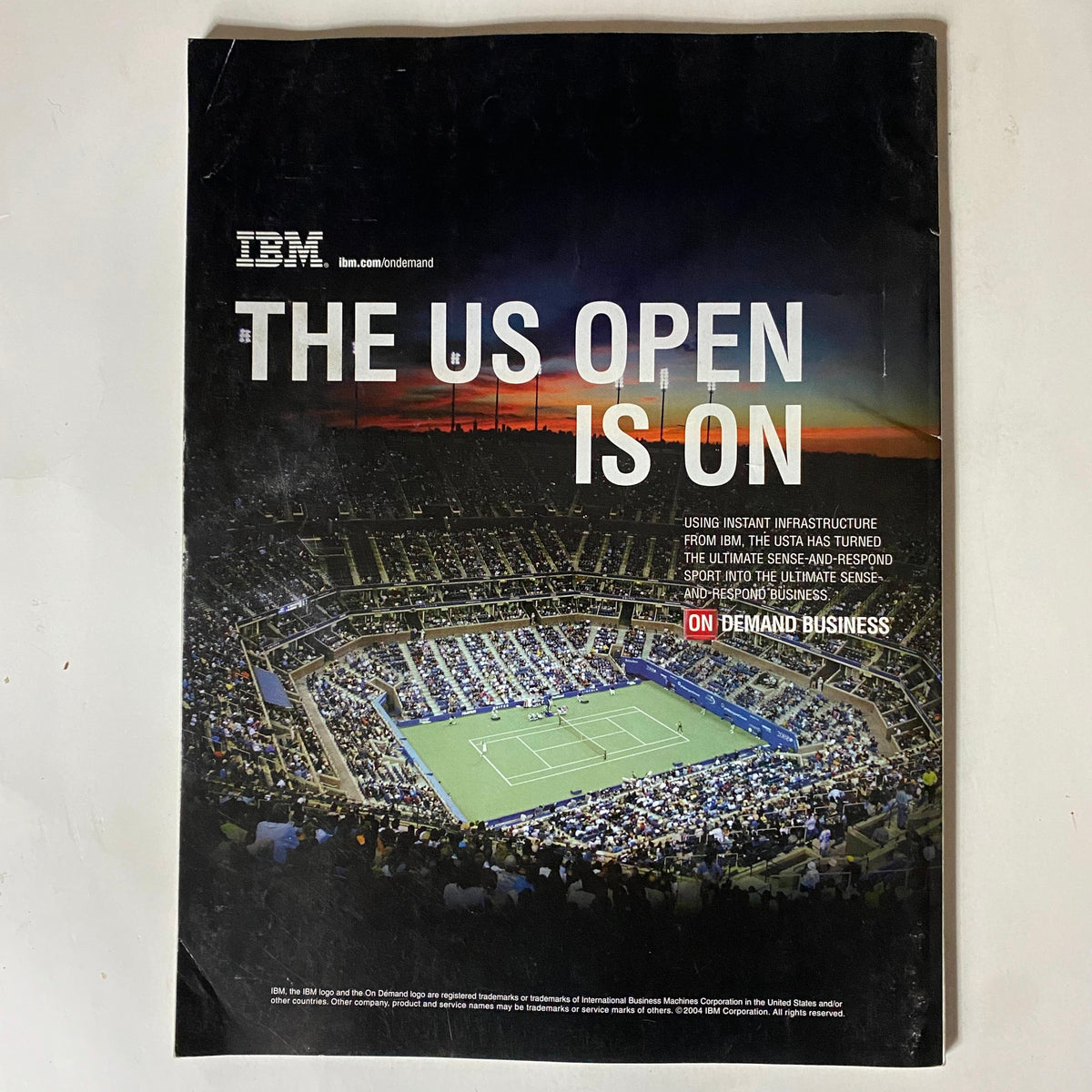 Back cover of Tennis Magazine September 2004 featuring an advertisement for the U.S. Open with a stunning view of the tennis court.