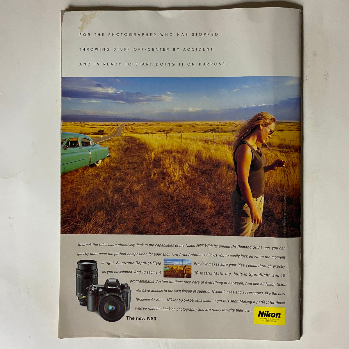 Back cover of Tennis Magazine November 2000, featuring a promotional advertisement for Nikon camera equipment, emphasizing photography.